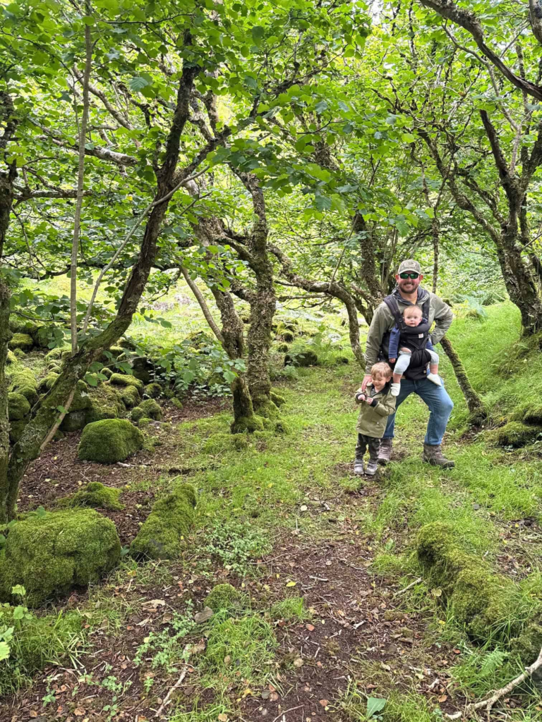 My husband, toddler, and baby exploring Fairy Glen in Isle of Skye