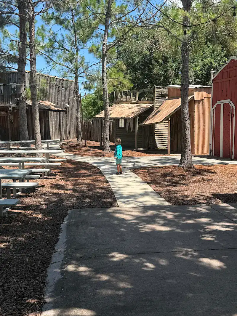 Toddler exploring the wilderness town at hyatt regency grand cypress