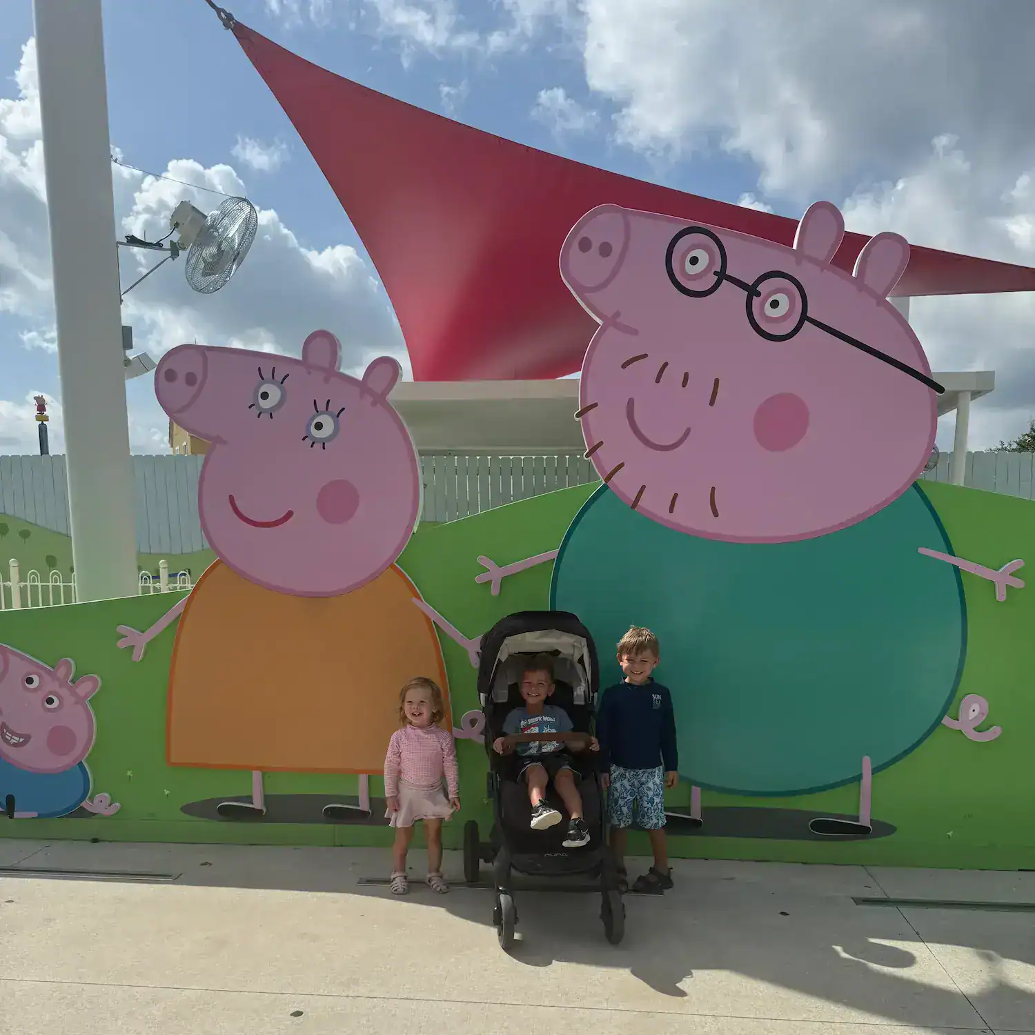 My toddlers and nephew outside the entrance of Peppa Pig World