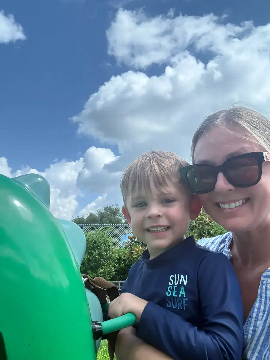 My son and I on the dinosaur ride at Peppa Pig World