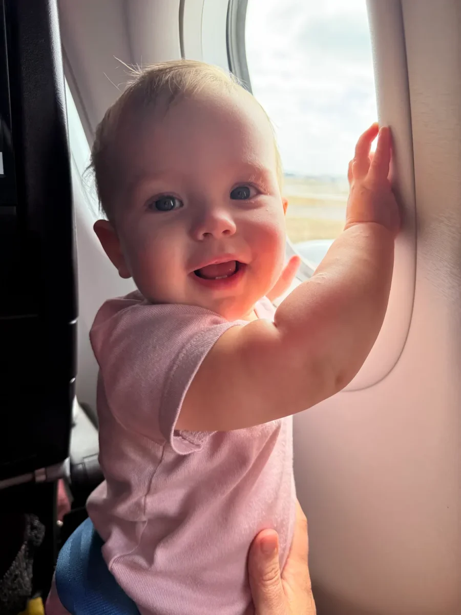 My daughter on a flight as a lap infant.