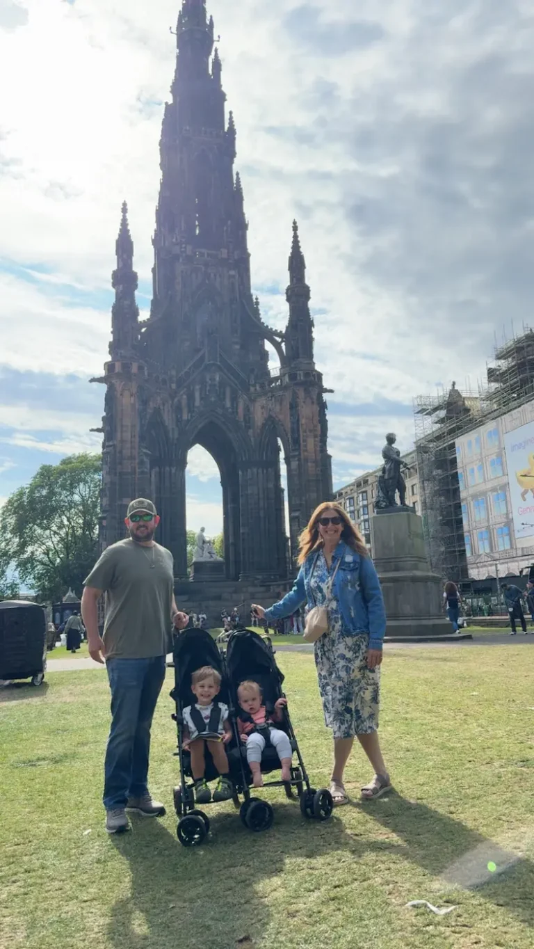 My husband and my mom standing in Front of Scott's Monument in Edinburgh
