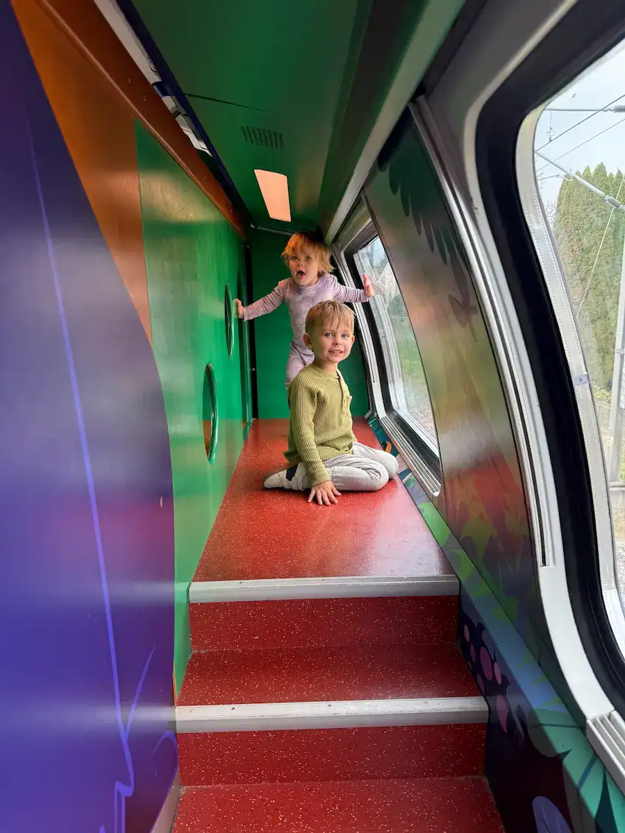 My kids playing on the playground inside the train in Switzerland