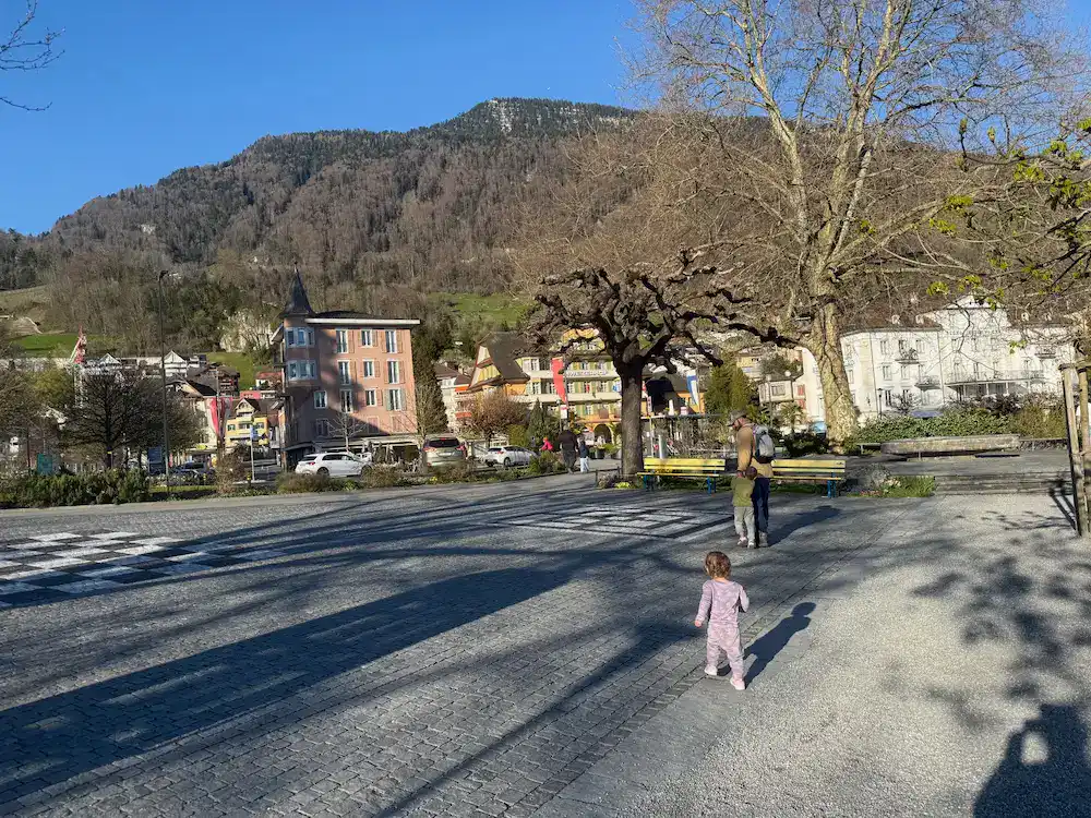 My daughter, husband and son outside of our hotel with Weggis in the background.