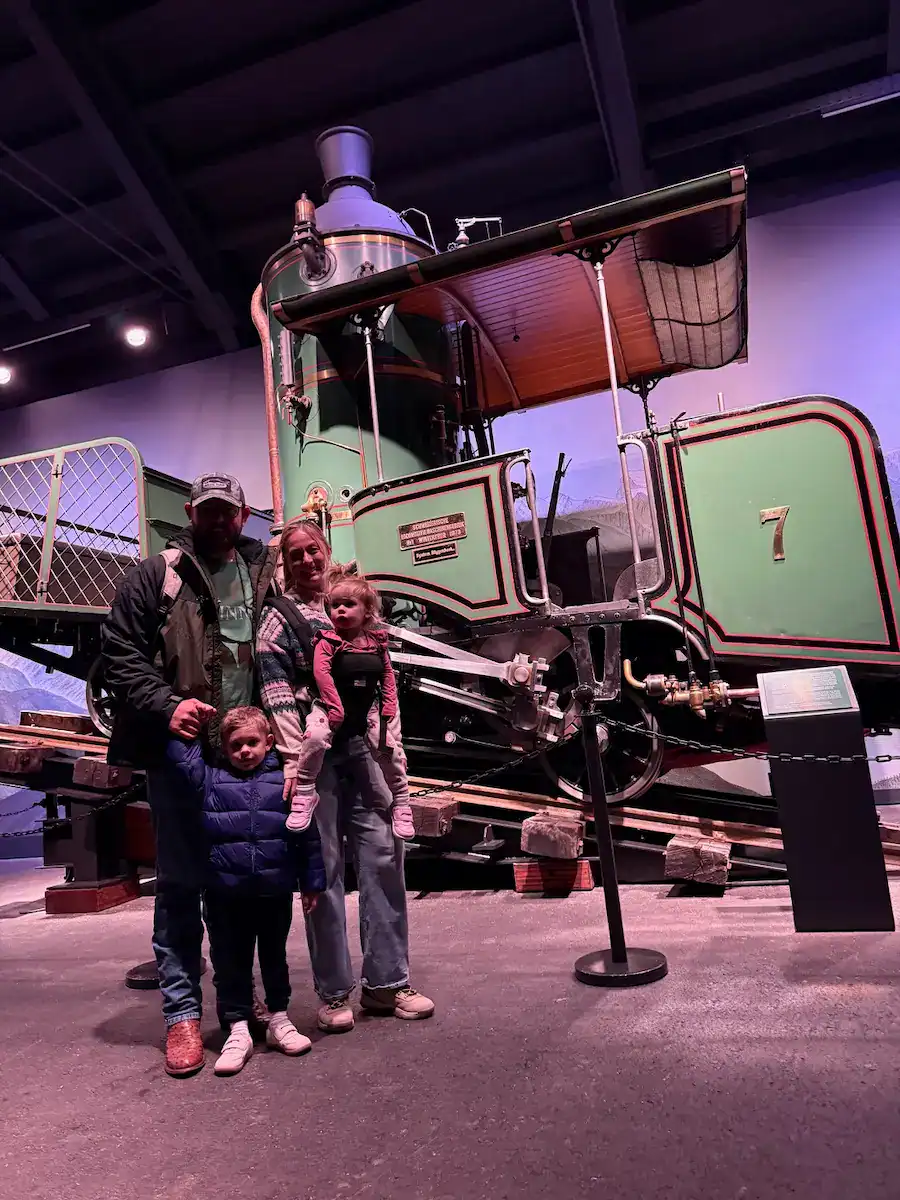 Us in front of the old cogwheel train at the train museum at the summit of Mt Rigi
